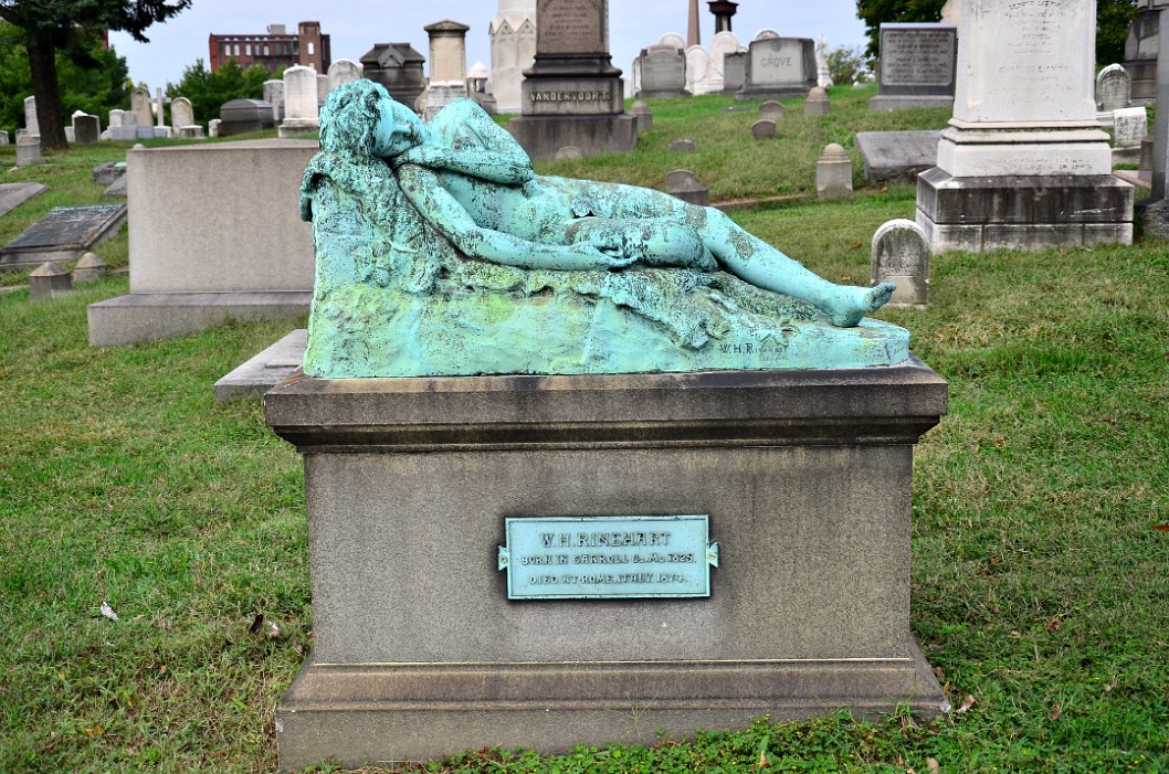 Green Patina on the Resting Bronze Statue of W. H. Rinnehart's Grave. Rinnehart Green Patina on the Resting Bronze Statue of W. H. Rinnehart's Grave. Rinnehart